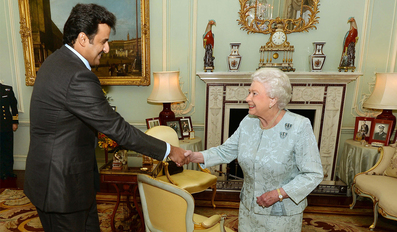 Amir with Queen Elizabeth